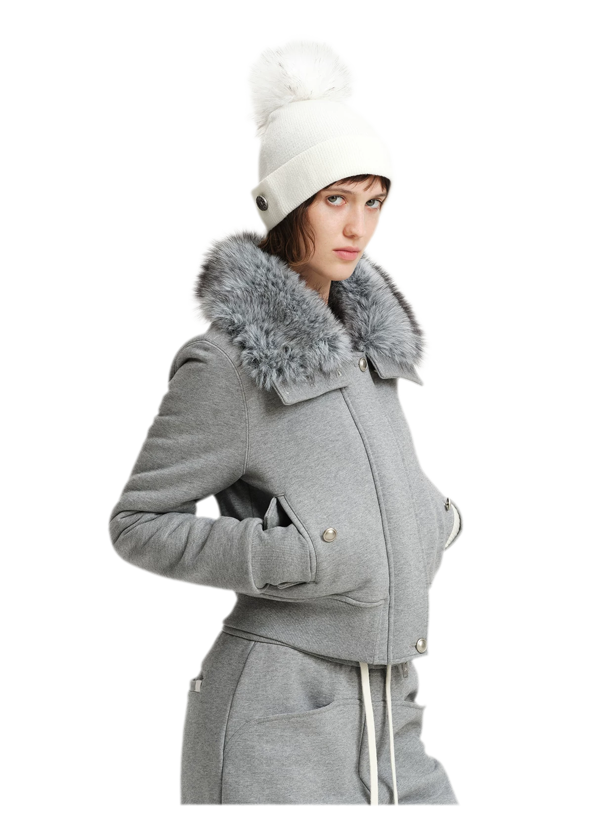 Cappello in lana con pompon e visiera