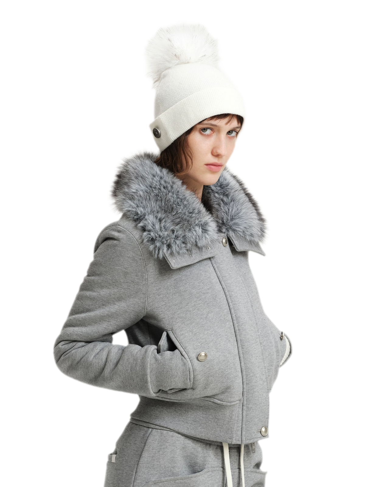 Cappello in lana con pompon e visiera