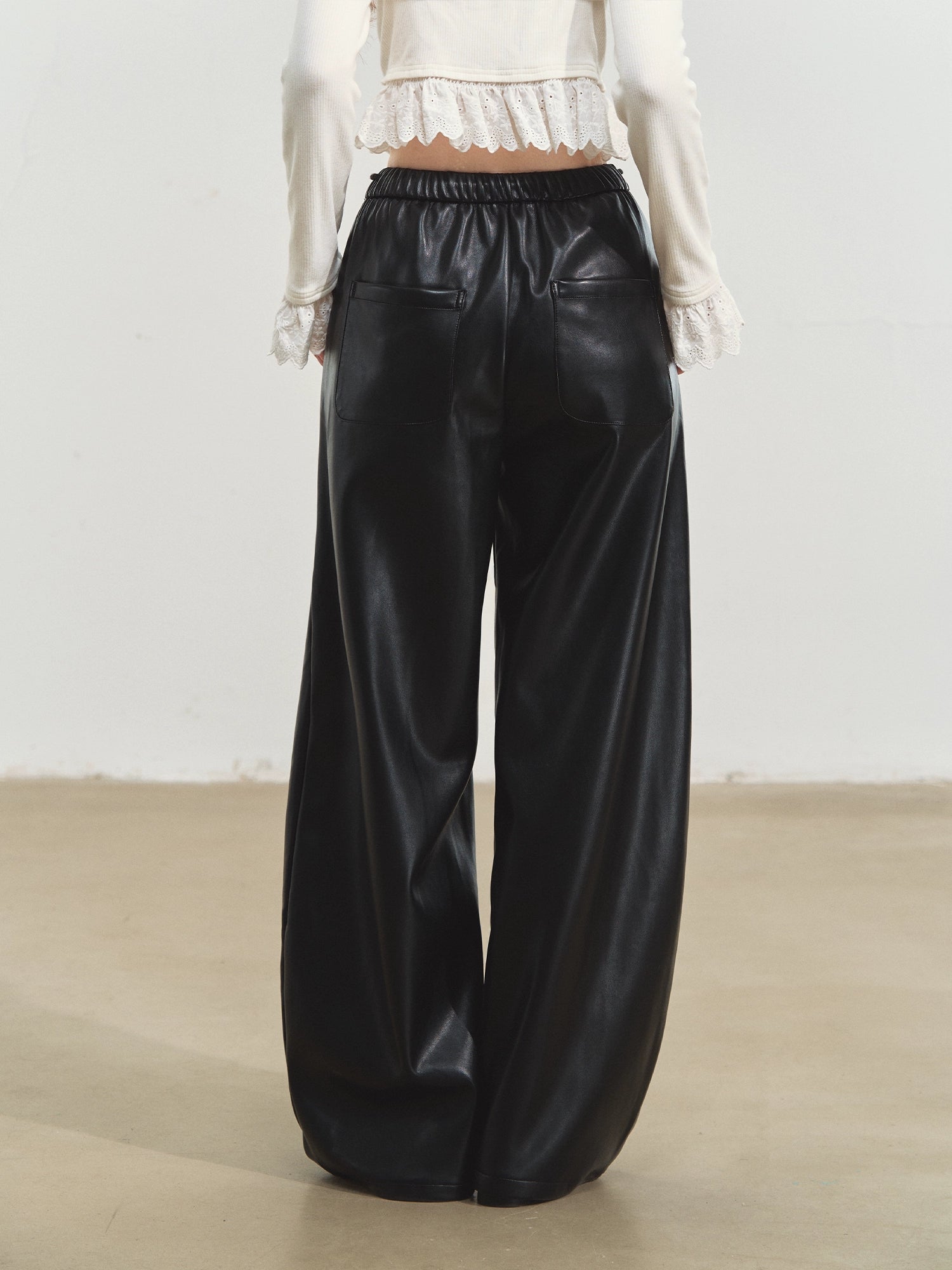 Relaxed Curve‑Hem PU Pants - CHINASQUAD