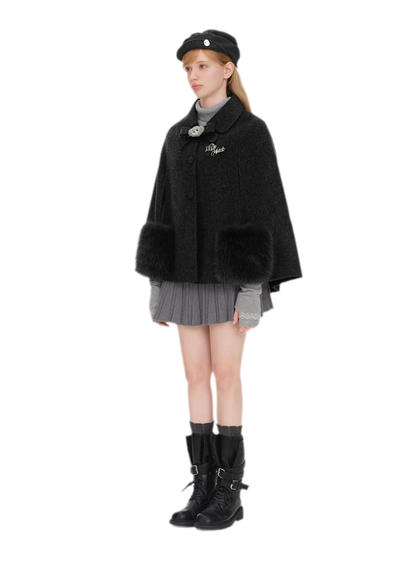 Cappotto mantella in peluche con fiocco