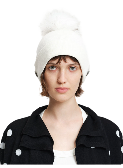 Cappello in lana con pompon e visiera