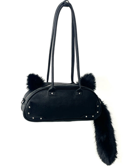 Bolso de mano de piel sintética con pompón de pedrería