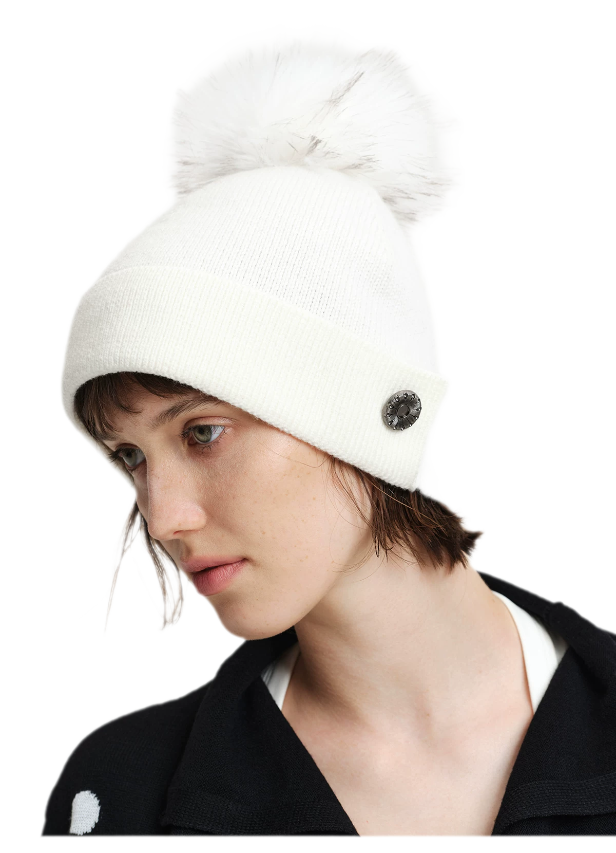 Cappello in lana con pompon e visiera