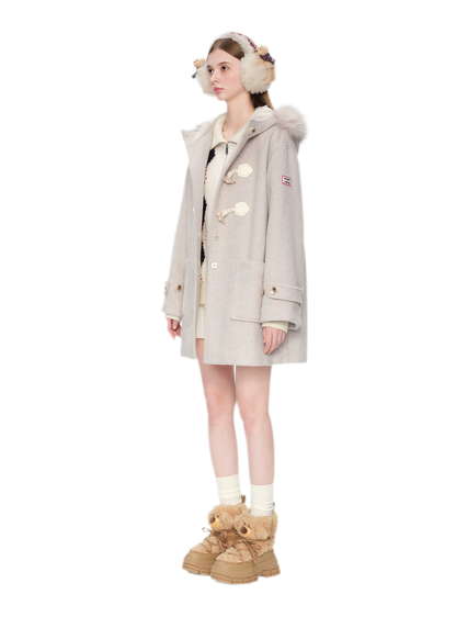 Manteau en laine texturée à boutons brandebourg