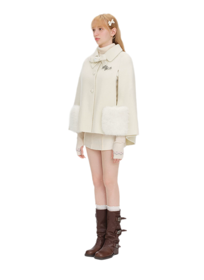 Cappotto mantella in peluche con fiocco