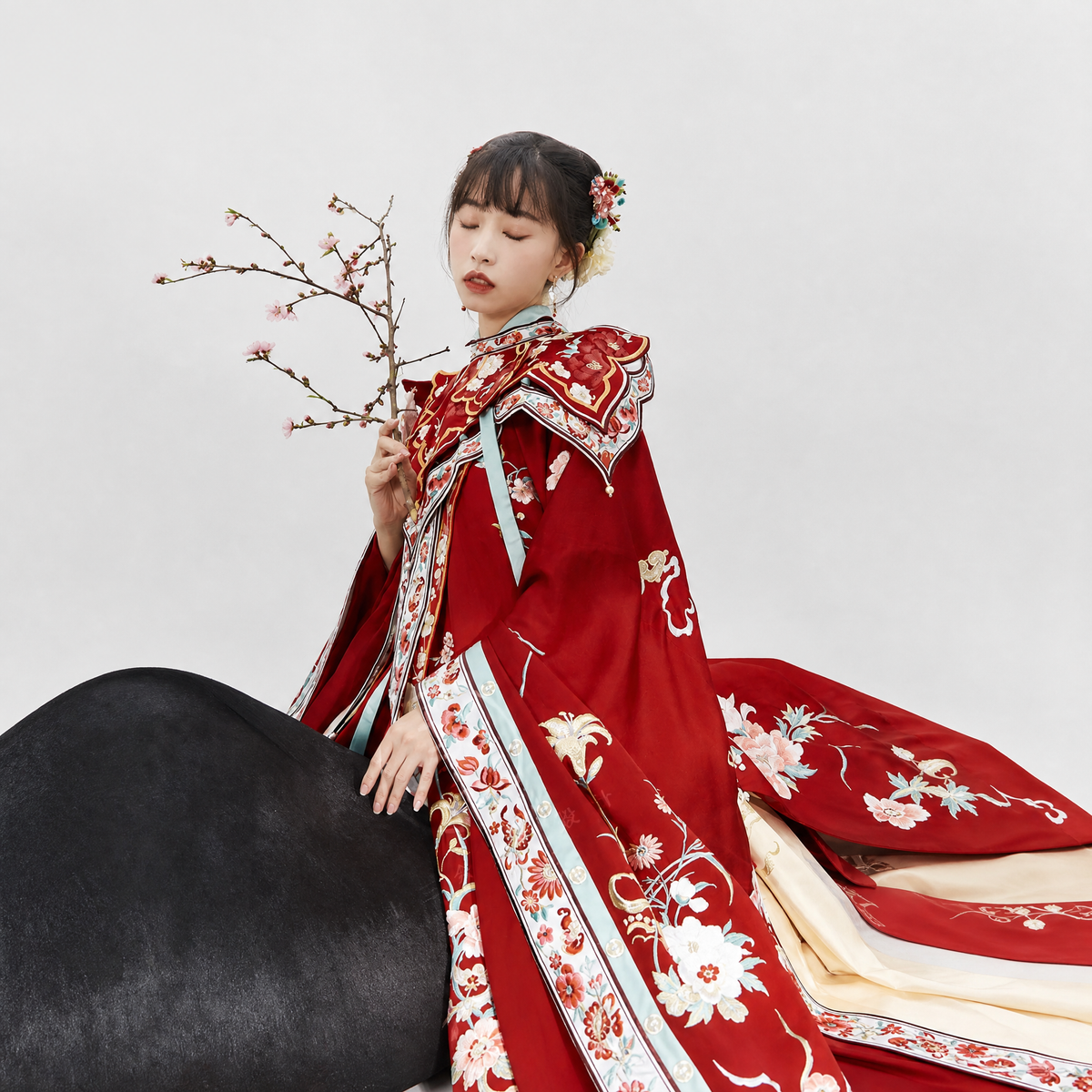 Detail of the Blossom Season red embroidered cape.