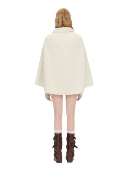 Cappotto mantella in peluche con fiocco