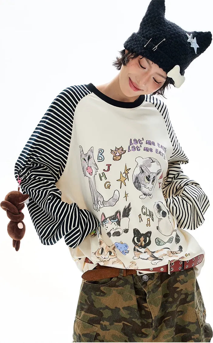Бавовняна футболка реглан із графічним принтом та довгими рукавами