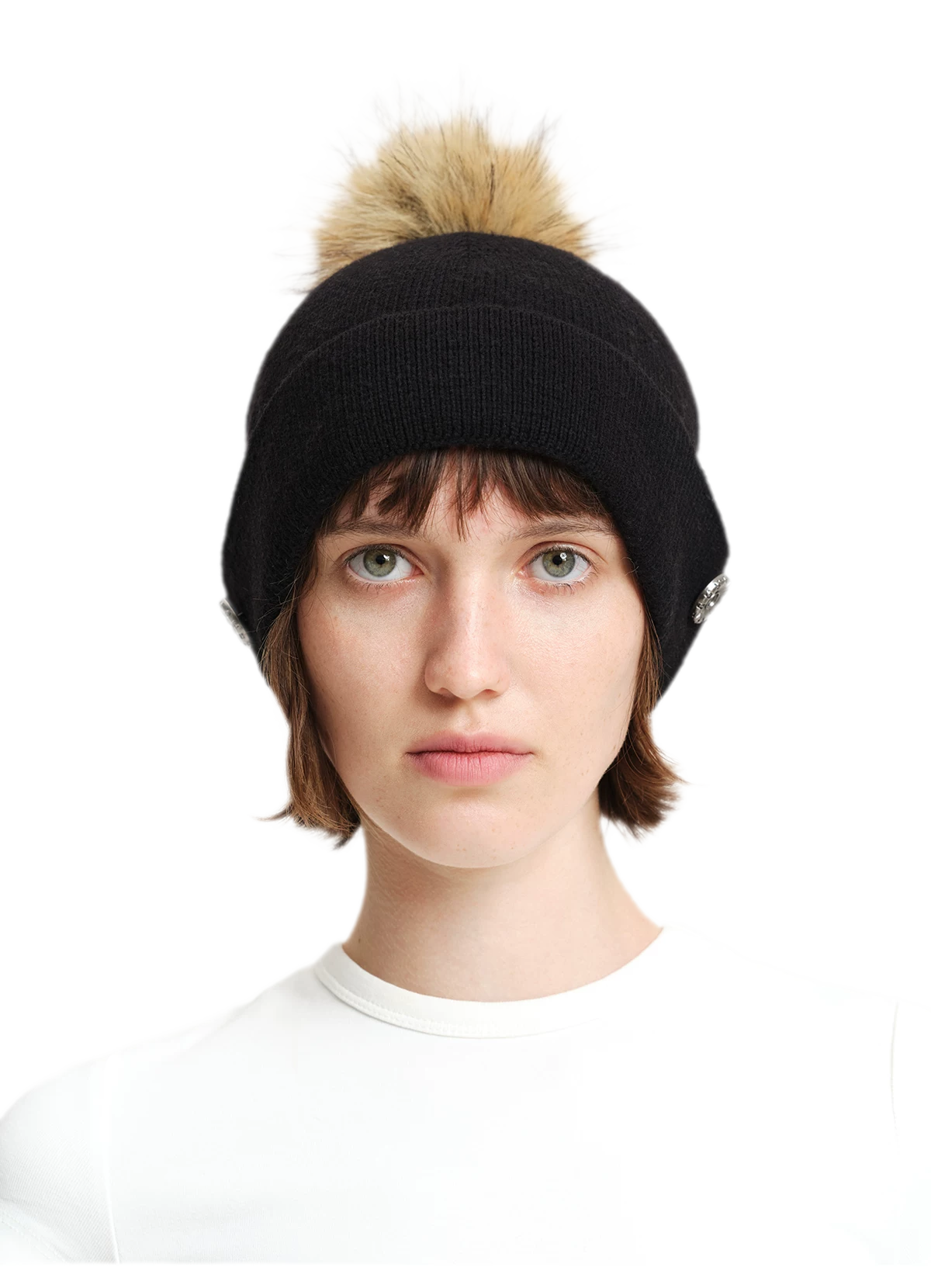 Cappello in lana con pompon e visiera