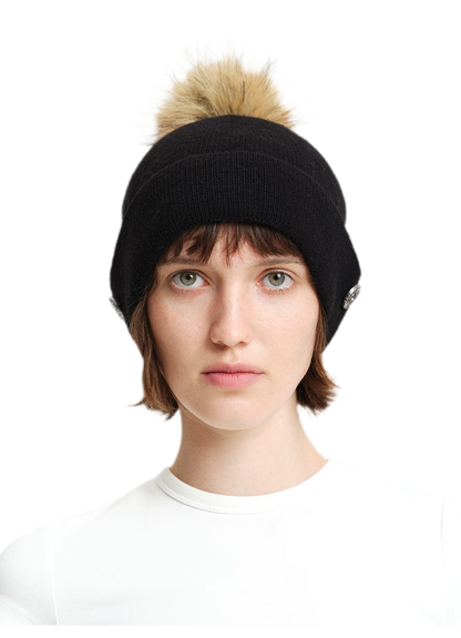 Cappello in lana con pompon e visiera