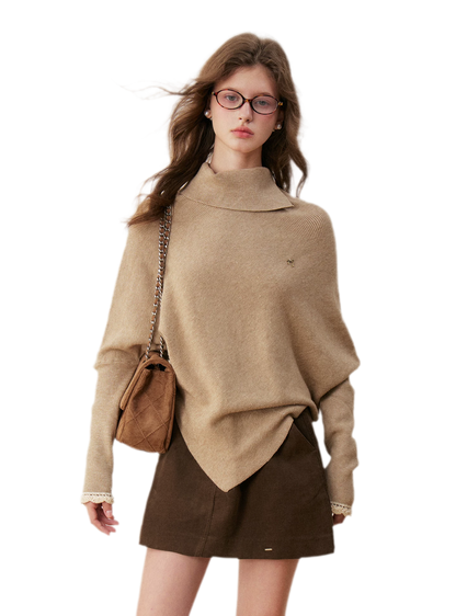Pull en crochet contrasté à manches chauve-souris
