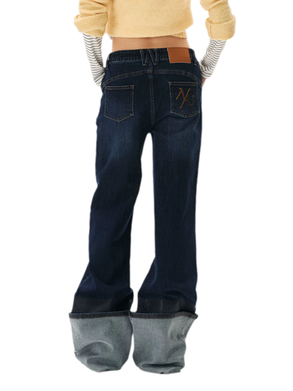 Washed Asymmetric Flare Jeans