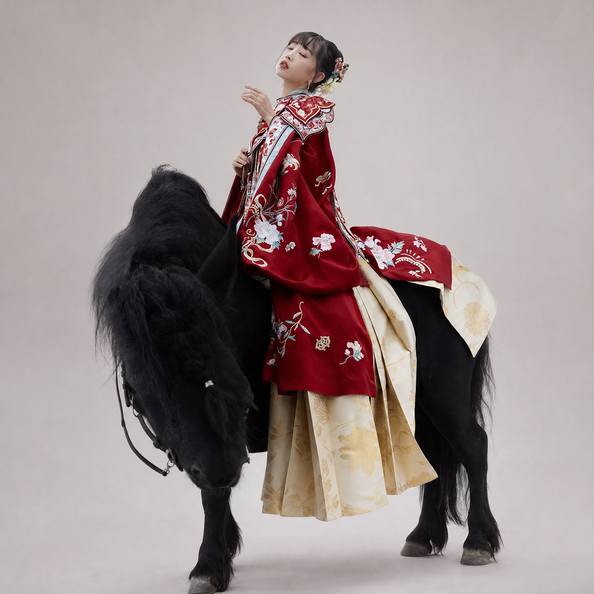 Blossom Season red embroidered Ming-style Hanfu beside a black horse.
