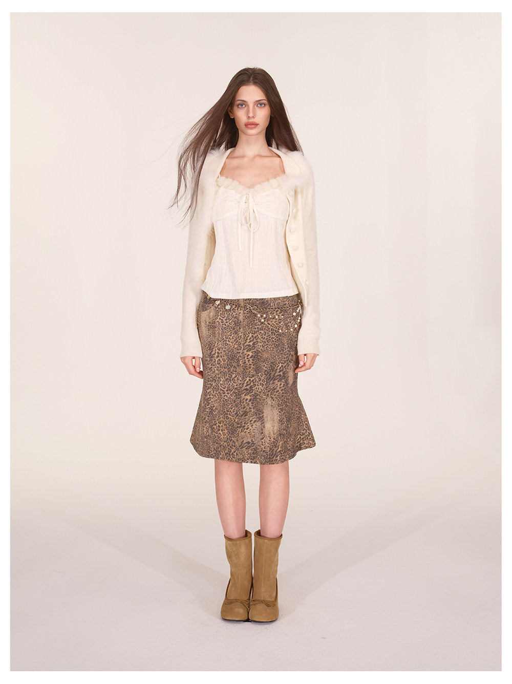Gilet court en maille avec bordure en fourrure de renard